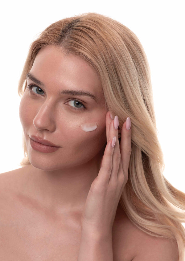 YURSLF pdrn cream on a woman face